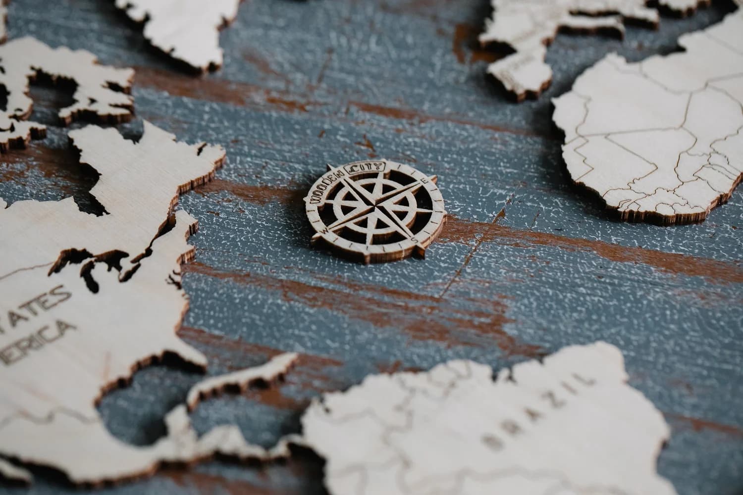 Wooden world map with a compass rose
